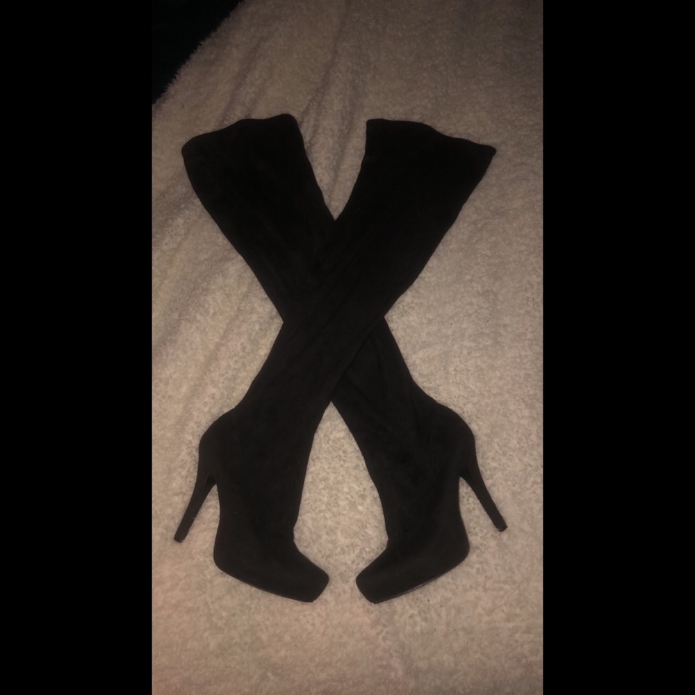 Thigh high heeled boots